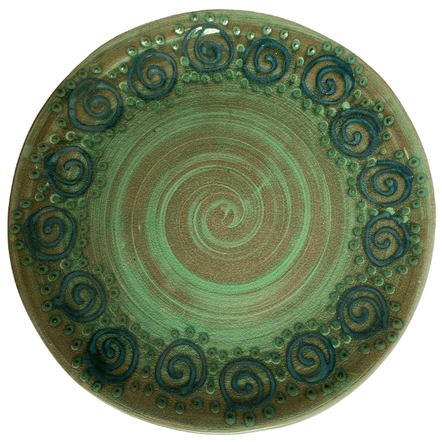 Pottery design with green background, turquoise squirls, green dots.
