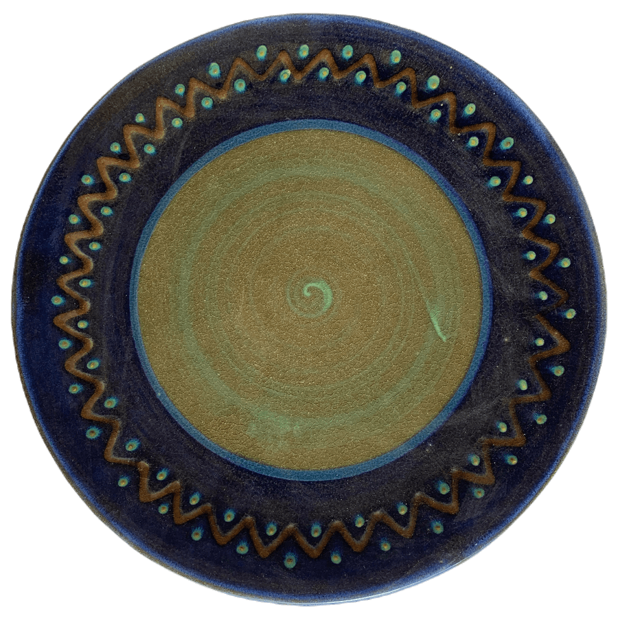 Pottery design with blue background, brown zig zags.