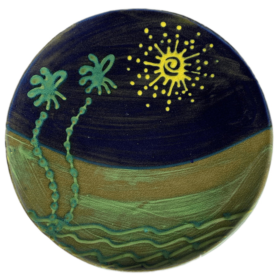 Round pottery design with spiky sun and palm tree pattern.